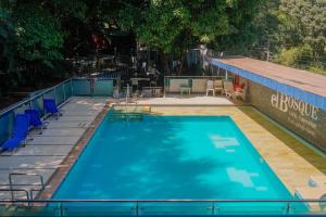 Bazén v ubytování Hotel El Bosque Valledupar nebo v jeho okolí