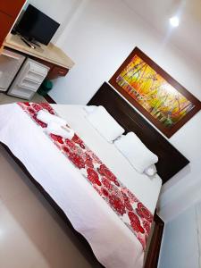 Postel nebo postele na pokoji v ubytování Hotel El Bosque Valledupar