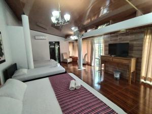 Postel nebo postele na pokoji v ubytování Hotel El Bosque Valledupar