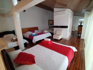 Postel nebo postele na pokoji v ubytování Hotel El Bosque Valledupar