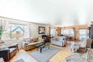 a large living room with couches and a table at Fox Lakeview Home in Bass Lake