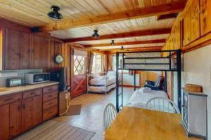 a kitchen with a bunk bed in a room at Fox Lakeview Home in Bass Lake