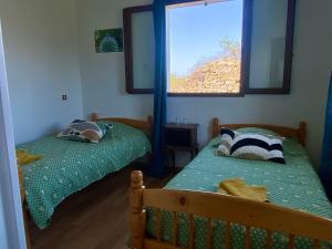 two twin beds in a room with a window at Auberge de Thiéry in Thiéry +26 photos