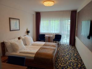 Postel nebo postele na pokoji v ubytování Simbad Hotel & Bar Superior