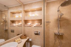 a bathroom with a shower and a toilet and a sink at Marina Varna Apartment-2BDR at South Bay Complex in Varna City +30 photos