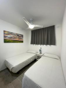 Postel nebo postele na pokoji v ubytování Apartamento Playa vistas 2 + 7 fotografií