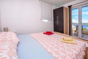 Ένα ή περισσότερα κρεβάτια σε δωμάτιο στο Apartments Ema
