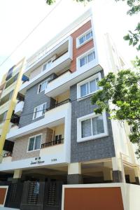 a tall building with windows and a balcony at HSR Parkside by Newstays in Bangalore