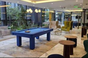 a pool table in the middle of a lobby at Luxury Building Studio - XOE in Quito