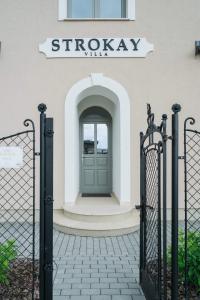 a door in a building with a sign that reads shockley at Villa Strokay - Few minutes walk from Lake Balaton in Keszthely