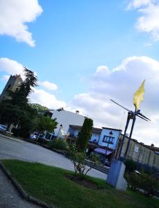 a statue of a bird on a windmill on a street at Vista Alegre Esquina in Vallromanes