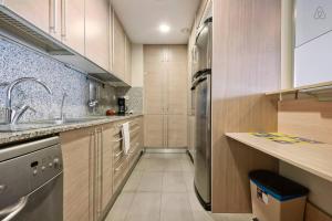 Kuchyň nebo kuchyňský kout v ubytování Apartment familiar