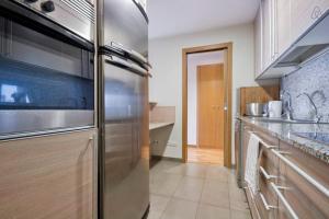 Kuchyň nebo kuchyňský kout v ubytování Apartment familiar