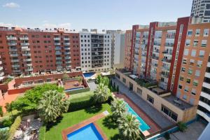 an aerial view of a city with tall buildings at Apartment familiar in Barcelona