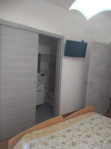 Postel nebo postele na pokoji v ubytování Affitta Camere Peluso