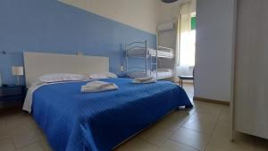 Postel nebo postele na pokoji v ubytování Hotel Canarco