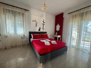 Postel nebo postele na pokoji v ubytování Aristos Apartments & Suites