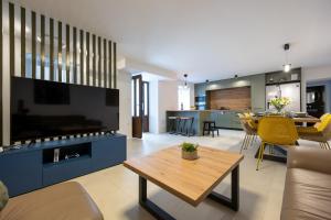 a living room with a couch and a table at Villa Fran, Krk in Sveti Vid-Miholjice
