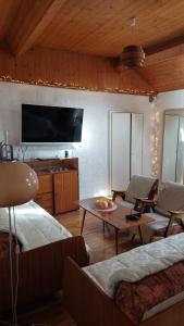 a living room with a flat screen tv on the wall at Kuća za odmor Arija in Novi Vinodolski
