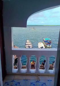 a view of the water from a window at Olympic Lamu sea front house - 2 bedroom All ensuite in Lamu