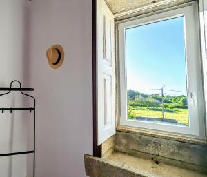 a window in a room with a view of a field at Torre de Santiago - Guest House in Vila Praia de Âncora +28 photos