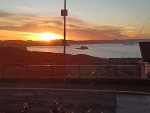 a sunset over a body of water at Locanda Maddalena - Accoglienza Pellegrini in Montefiascone