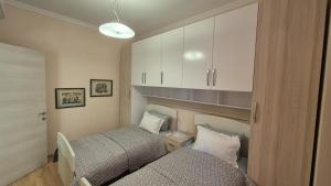 Postel nebo postele na pokoji v ubytování Aurora appartment
