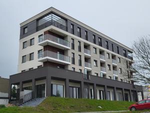 a large building with balconies on the side of it at Apartament Broniewskiego in Busko-Zdrój