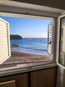 a window with a view of the beach at Las Velas in Las Palmas de Gran Canaria