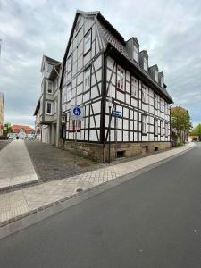 a black and white building on the side of a street at SecretApartment: Fewo in Warburg in Warburg