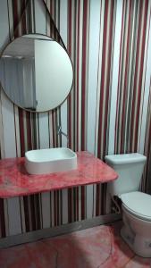 a bathroom with a sink and a toilet at Albergue Cultural Hostel in Rio de Janeiro +12 photos
