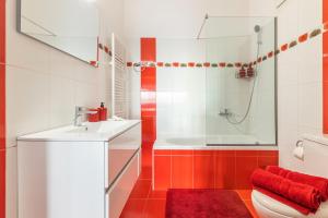 a bathroom with a toilet and a sink and a shower at Iliovasilema Luxury Apartment in Heraklio Town