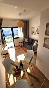 a living room with a bowl of fruit on a table at Amarillo Costa Calma Sun in Costa Calma