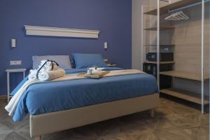 Postel nebo postele na pokoji v ubytování Gigli Rooms