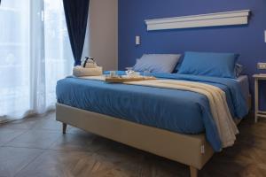 Postel nebo postele na pokoji v ubytování Gigli Rooms