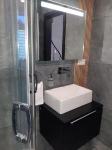 Ένα μπάνιο στο Apartament Morski Sen -Pachnący nowością-oddany do użytku w kwietniu 2024