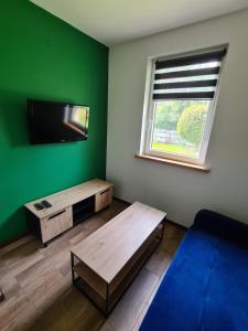 Postel nebo postele na pokoji v ubytování Noclegi przy Wiadukcie - Apartamenty