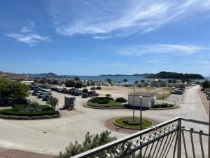 a view of a parking lot from a balcony at Apartmani Šaldi in Pakoštane