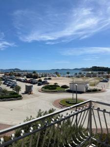 a view of a parking lot from a balcony at Apartmani Šaldi in Pakoštane