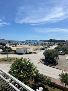 a view from a balcony of a parking lot at Apartmani Šaldi in Pakoštane