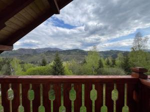 a view of the mountains from the deck of a cabin at Kolos house in Slavske
