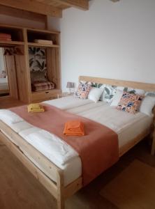 a bedroom with two beds with an orange towel on them at Casa Virginia in Ouzenda