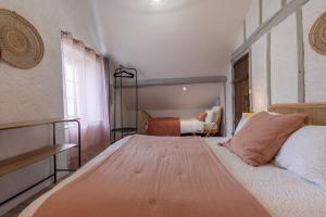 Posteľ alebo postele v izbe v ubytovaní Le Cottage de Chitenay