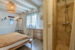 Posteľ alebo postele v izbe v ubytovaní Le Cottage de Chitenay