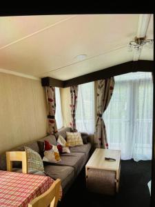 a living room with a couch and a table at Relax & Dream in Edinburgh