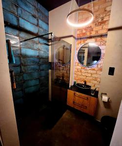 a bathroom with a sink and a mirror at Luxury Vistula Old Town Apartments , hammock on the terrace, free parking! in Krakow