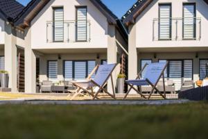 Zdjęcie z galerii obiektu Domki Nord Breeze z podgrzewanym basenem i jacuzzi we Władysławowie