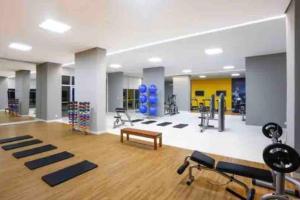 a gym with several exercise equipment in a room at Lazer e shopping Apt DF Plaza in Brasília