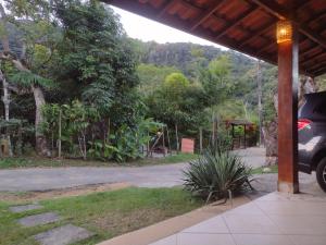 a car parked on the side of a road at CASA PRUMIRIM in Ubatuba