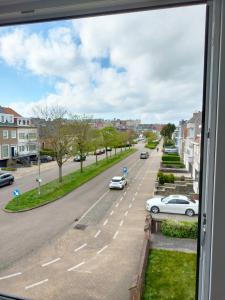 a view from a window of a street with cars at Project 9 in Ostend